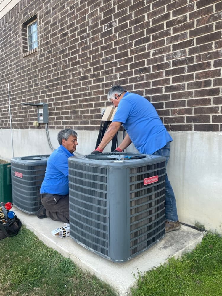 Technician replacing a damaged capacitor in Bulverde, TX