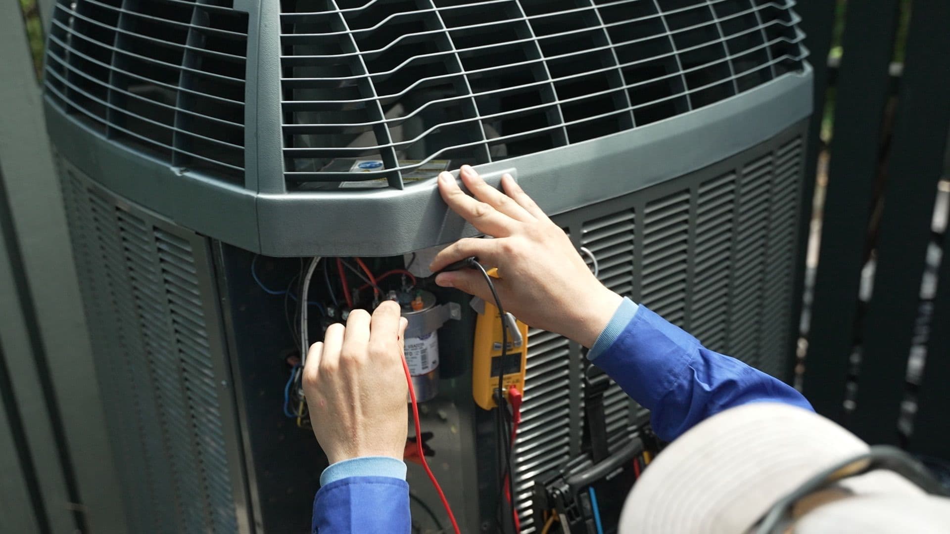 ac american air technician servicing compressor